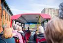Guests on the open top bus tour approach Norwich Castle. Picture: Richard Jarmy Photography