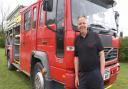 Phill Clark, contract haulier, with the fire engine he bought on a whim and is now selling at Besthorpe.