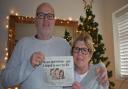 Chris and Tina Hardesty with the 2011 Norwich Evening News story which appeared after his life was saved a decade ago