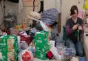 A volunteer sorting through donations for Baby Bank Norfolk