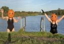 Sisters Kate Moore and Bethany Dowe took to the open water with pumpkins on their heads for Halloween