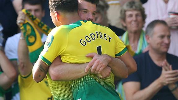 Norwich Evening News: Grant Hanley celebrates Pukki's hat-trick Norwich Evening News: Grant Hanley celebrates Pukki's hat-trick