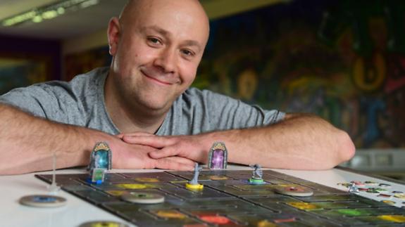 Norwich Evening News: Damon Pritchard, organiser of the 24 hour board games marathon called Dicing with Boardom, to raise money for The Base. Picture: DENISE BRADLEY Norwich Evening News: Damon Pritchard, organiser of the 24 hour board games marathon called Dicing with Boardom, to raise money for The Base. Picture: DENISE BRADLEY