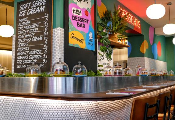 Norwich Evening News: The main attraction of Milk Dessert Bar is the conveyor belt Picture: Fixr Norwich Evening News: The main attraction of Milk Dessert Bar is the conveyor belt Picture: Fixr