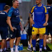 King's Lynn Town defender Josh Coulson chats to Norwich City head coach Dean Smith after the friendly match at The Walks