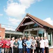 Staff and volunteers at Priscilla Bacon Lodge pictured before Covid