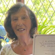 Marion Billham, 80, of Brundall, with her Platinum Champion Awards certificate