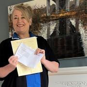 Wendy Kimberley has been invited to the Queen's funeral. Here she is pictured earlier this year with the letter confirming her as a Medallist of the Order of the British Empire (BEM)