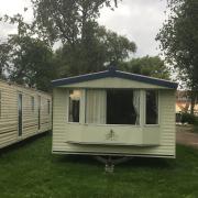 Static caravans outside of the car park of the Beauchamp Arms pub. Picture: David Hannant