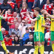 City players celebrate after Kieran Dowell pulls a goal back for the Canaries at Old Trafford