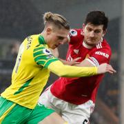 Przemyslaw Placheta tries to get the better of Harry Maguire in Norwich City's last Premier League tussle with Manchester United