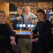 Hugh Bonneville (third from right) who plays Lord Grantham in the hit TV series wined and dined in The Crown Inn, in Pulham Market, on Thursday evening [November 11].