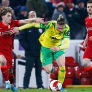 Norwich City exited the FA Cup after a 2-1 defeat to Liverpool at Anfield.