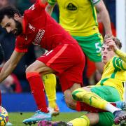 Brandon Williams snaps into a challenge on Mo Salah in Norwich City's 3-1 Premier League defeat at Liverpool