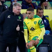 Norwich boss Dean Smith gives instructions to Max Aarons during defeat to Manchester City