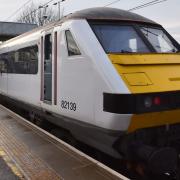 Trains in and out of Norwich are being delayed after a vehicle hit a bridge
