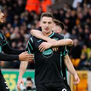 Canaries midfielder Kenny McLean celebrates his goal at Wolves with Billy Gilmour and Adam Idah, left
