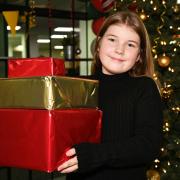 Maisie, 9, is giving 50 presents to a food bank for children to enjoy this Christmas. Pictures: Brittany Woodman