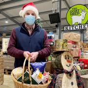 Sam Steggles with a Christmas hamper at the Goat Shed farm shop in Honingham