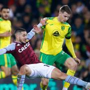 Emi Buendia tussles for the ball on his Norwich City return for Aston Villa