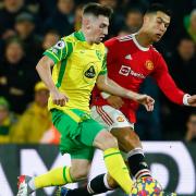 Billy Gilmour of Norwich and Cristiano Ronaldo of Manchester United in action during the Premier League match at Carrow Road