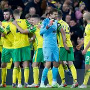 The Norwich players celebrate victory at the end of the Premier League match at Carrow Road