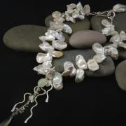 Neckless of Japanese pearls with aquamarines, sapphires, diamonds, moonstones, labradorite and seed pearls inspired by seaweed found on Holkham beach. Made by Lisa Bambridge of Stoned and Hammered