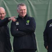 Norwich City head coach Dean Smith watches training at Colney alongside head of football development Steve Weaver, left, and assistant coach Craig Shakespeare, right