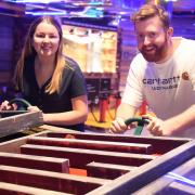 Louisa Baldwin and James Randle play crazier golf at the newly opened Boom: Battle Bar in Norwich's Castle Quarter. Picture: DENISE BRADLEY