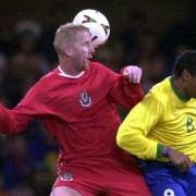 Iwan Roberts on international duty for Wales, against Brazil, in 2000