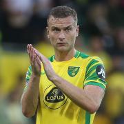 Ben Gibson applauds the Norwich City fans following defeat to Liverpool at Carrow Road