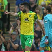 Norwich City captain Grant Hanley issues his instructions to Max Aarons after Liverpool's second goal