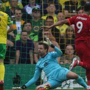 Roberto Firmino slots Liverpool's second goal past Norwich City keeper Tim Krul