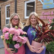 Sisters Sarah Turcu and Lisa Bolingbroke outside The Watering Can plant and gift shop at White House Farm in Sprowston