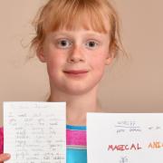 Elona Moore, seven, from Colton, with her letters that she wrote to prime minister Boris Johnson and South Norfolk MP Richard Bacon over UK government cuts to UNICEF.