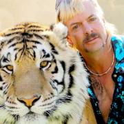 Tiger King Joe Exotic with one of the animals from his zoo