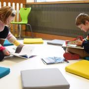 Youngsters enjoying books at the Norfolk and Norwich Millennium Library