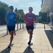 Neil Bunnage and Luke Guy begin their 10km run around the city from the Theatre Street start line of the postponed Run Norwich 2022