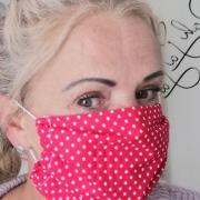 Annie Reilly wearing one of the hundeds of face masks she has made during the coronavirus lockdown. PIC: Annie Reilly.