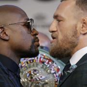 Floyd Mayweather Jr., left, and Conor McGregor will fight in Las Vegas on Saturday. Picture: AP PHOTO