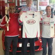 Left to right, Sprowston Cricket Club vice-chairman Sudhir Sudy Trivedi, NMG managing director Grant Long and cricket club captain Graham Hampson with the new kit sponsored by NMG and Kia and bat signed by Alec Stewart, a former England captain. Picture: