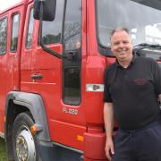 Phill Clark, contract haulier, with the fire engine he bought on a whim and is now selling at Besthorpe.