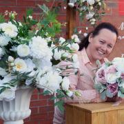 Wedding planner Charlene Goldsmith, of Goldsmith's Weddings and Events, with some of her decorations for outside weddings. Picture: DENISE BRADLEY