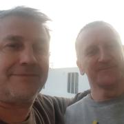 Mark Robinson (right) from Norwich with his best friend Chris Enmarch on the ferry back to Dover following a week-long trip to Ukraine