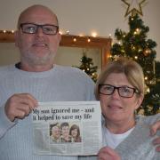 Chris and Tina Hardesty with the 2011 Norwich Evening News story which appeared after his life was saved a decade ago