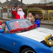 Father Christmas and his elf helper visiting Cecil Gowing Infant School pupils in Sprowston