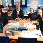 Headteacher Edward Savage with some of the pupils at Falcon Junior School celebrating their new look classrooms after extensive refurbishment due to flooding in 2020. From left, the nine-year-olds are: Harley, Ethan, Thea, Isabelle and Miracle