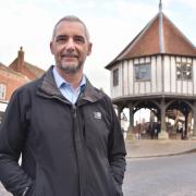 Kevin Hurn, Wymondham town and district councillor, in Wymomdham's Market Place and in front of the HSBC bank which is closing in August 2023