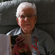 Rouse Voisey - pictured here with his birthday card from the Queen - has died age 102