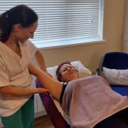 Emily Egle receives manual lymphatic drainage from therapist Lucy Grubb